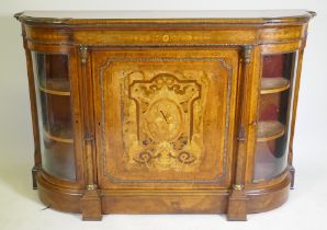 A Victorian inlaid burr walnut credenza with brass mounts, two bow end glazed doors and central