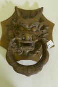 A Chinese bronze dragon's mask door knocker, 27cm high