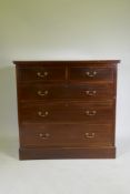 A Victorian inlaid mahogany chest of two over three drawers, raised on a plinth base, 107 x 51 x