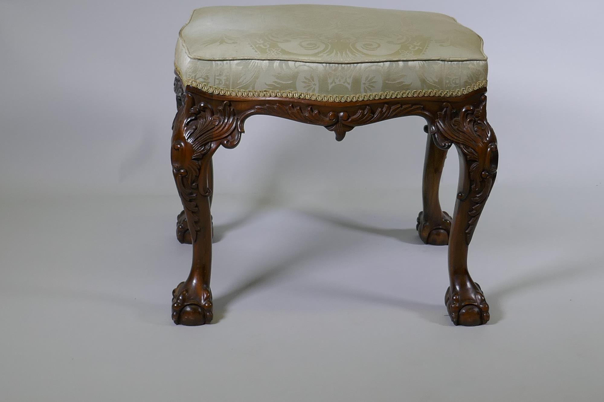 A Georgian style serpentine shaped walnut stool, with carved decoration, raised on cabriole - Image 2 of 4