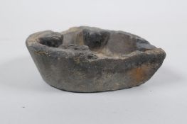 An antique carved stone oil lamp, 13 x 10cm