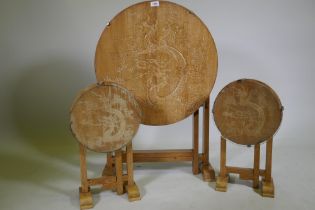 A set of three Art Deco limed oak occasional tables with carved Chinese dragon decoration, largest