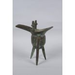 A Chinese archaic style bronze jue, 18cm high