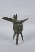 A Chinese archaic style bronze jue, 18cm high