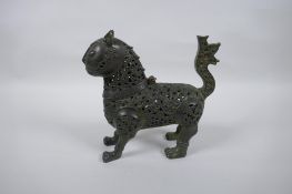 A Persian pierced bronze iron censer and cover, 17cm high