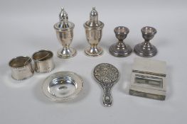 A quantity of hallmarked silver to include a pair of sifters with glass liners, a trinket dish by