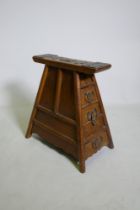 A C19th Chinese elm barber's stool with decorative bronze mounts and four end drawers, 43 x 26cm,