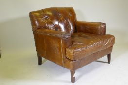A Halo button back leather easy chair