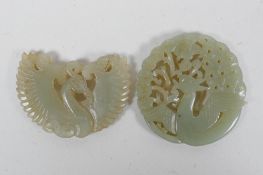 A Chinese carved and pierced celadon jade phoenix pendant, and another, 5.5cm diameter