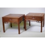 A pair of Chinese red wood side tables with a single drawer, 61 x 61cm, 55cm high