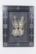 A Thai white metal relief depicting Rama & Sita, mounted on a mother of pearl inlaid panel, 30 x