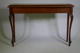 A mahogany hall table, raised on carved shaped supports, 112 x 27 x 77cm