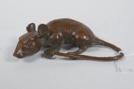 A Japanese style bronze okimono rat, 8cm long