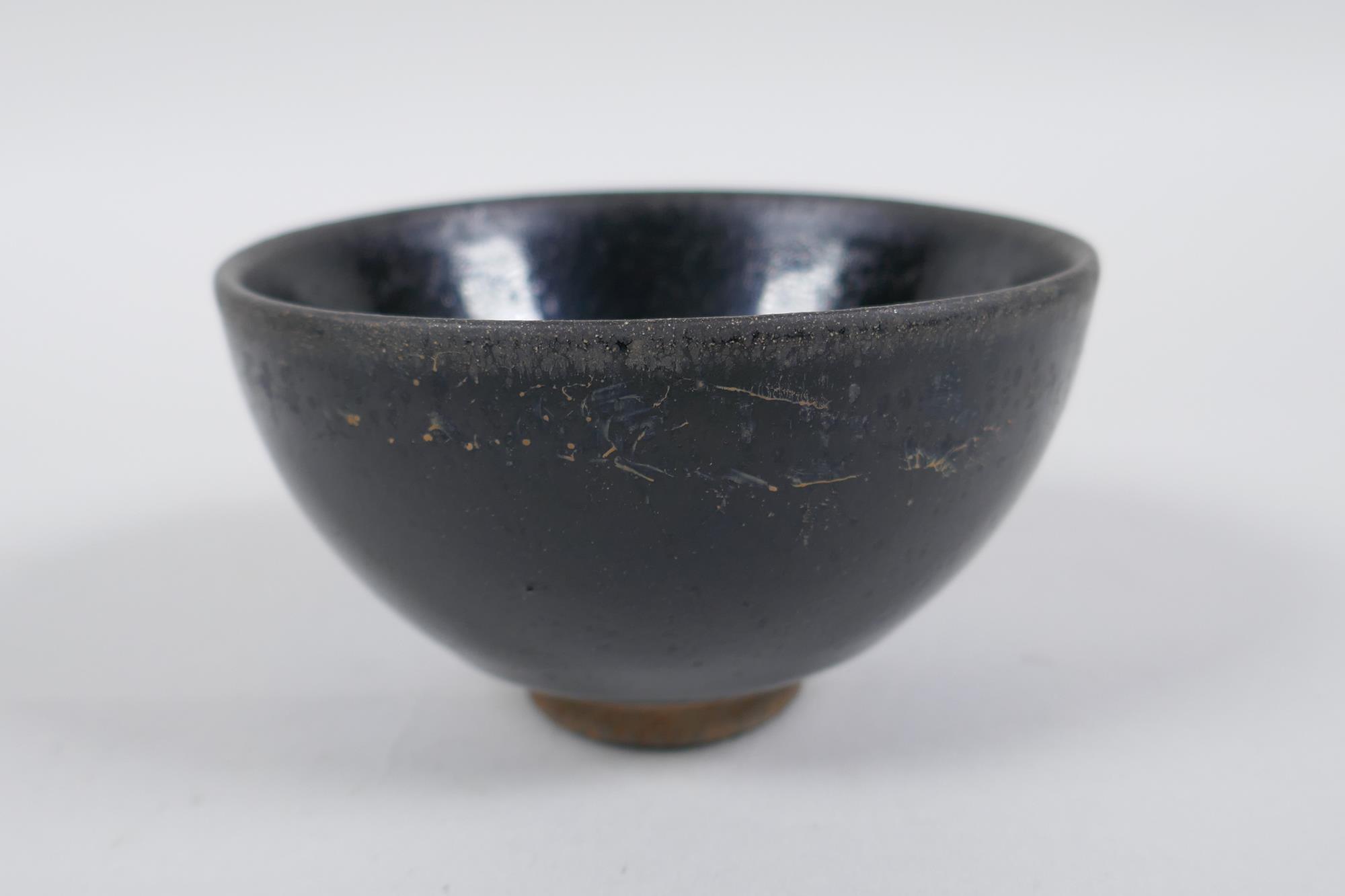A Chinese Jian Kiln tea bowl with hares fur glaze, and another with a treacle glaze, 9cm diameter - Image 6 of 8