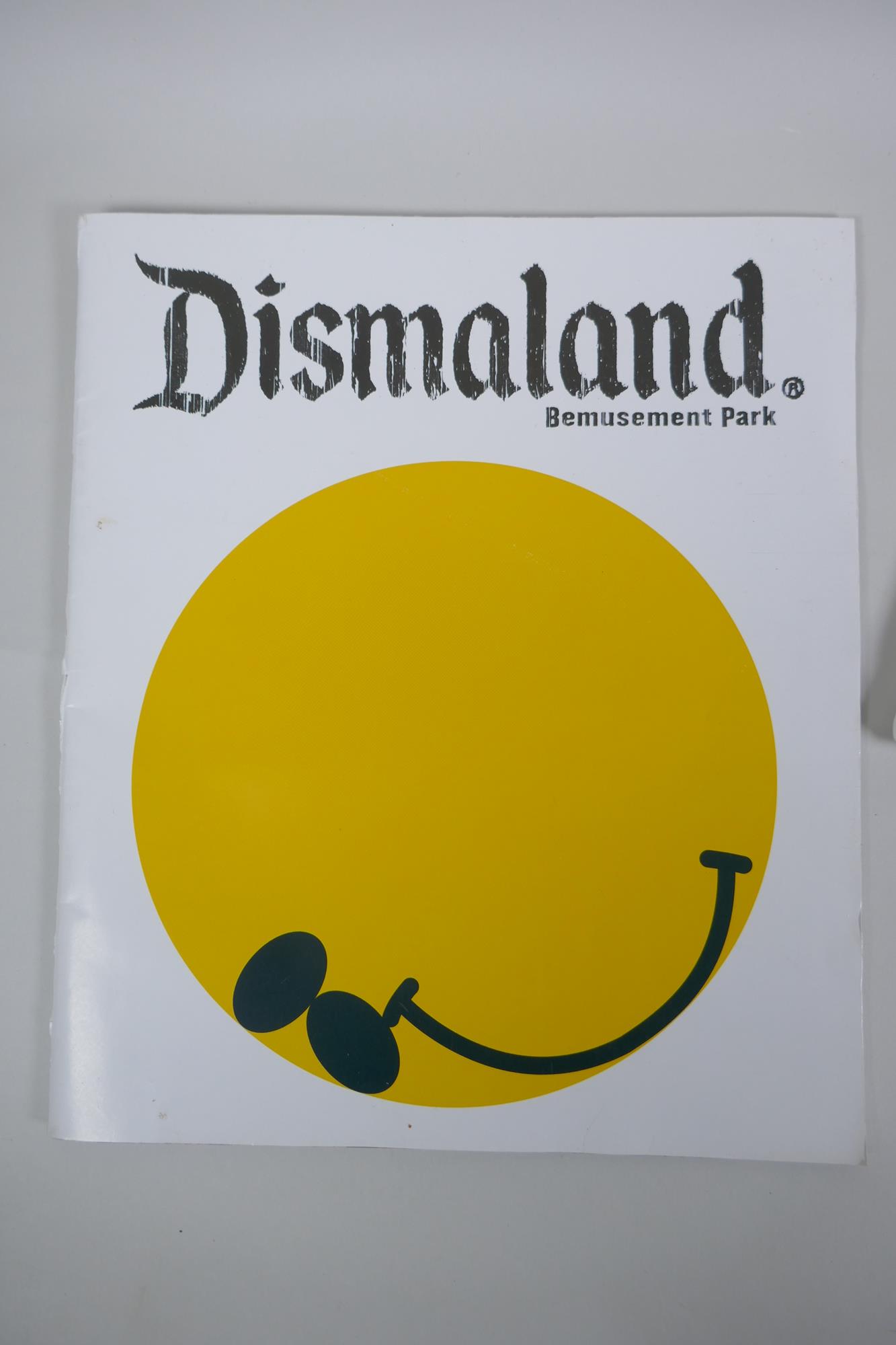 After Banksy, a Dismaland brochure, Dismaland T-shirt (child size M), and two FCK-PTN! postcards, - Image 2 of 8