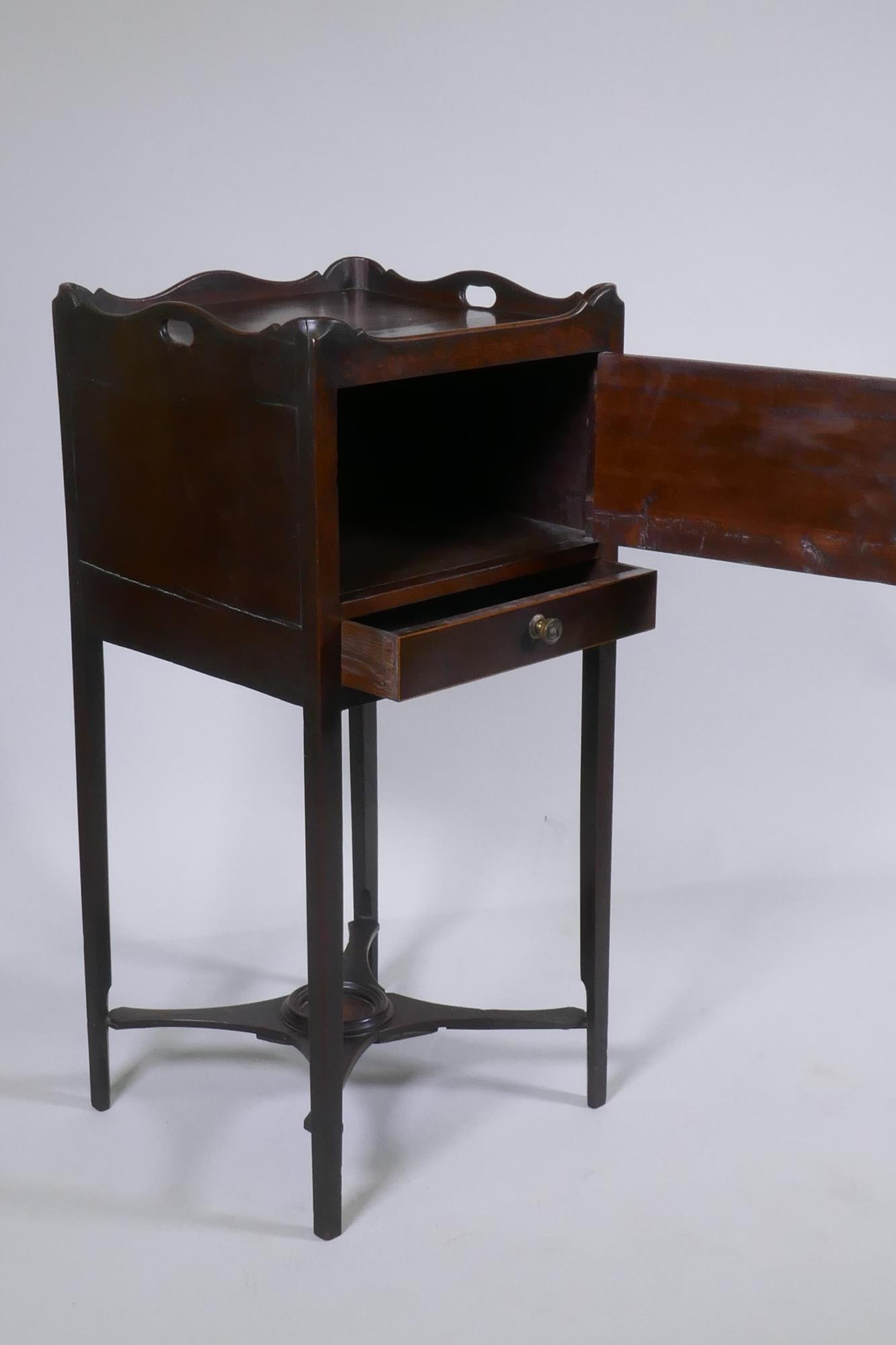 A George III mahogany pot cupboard with a shaped gallery top and single door over a cross stretchers - Image 3 of 4