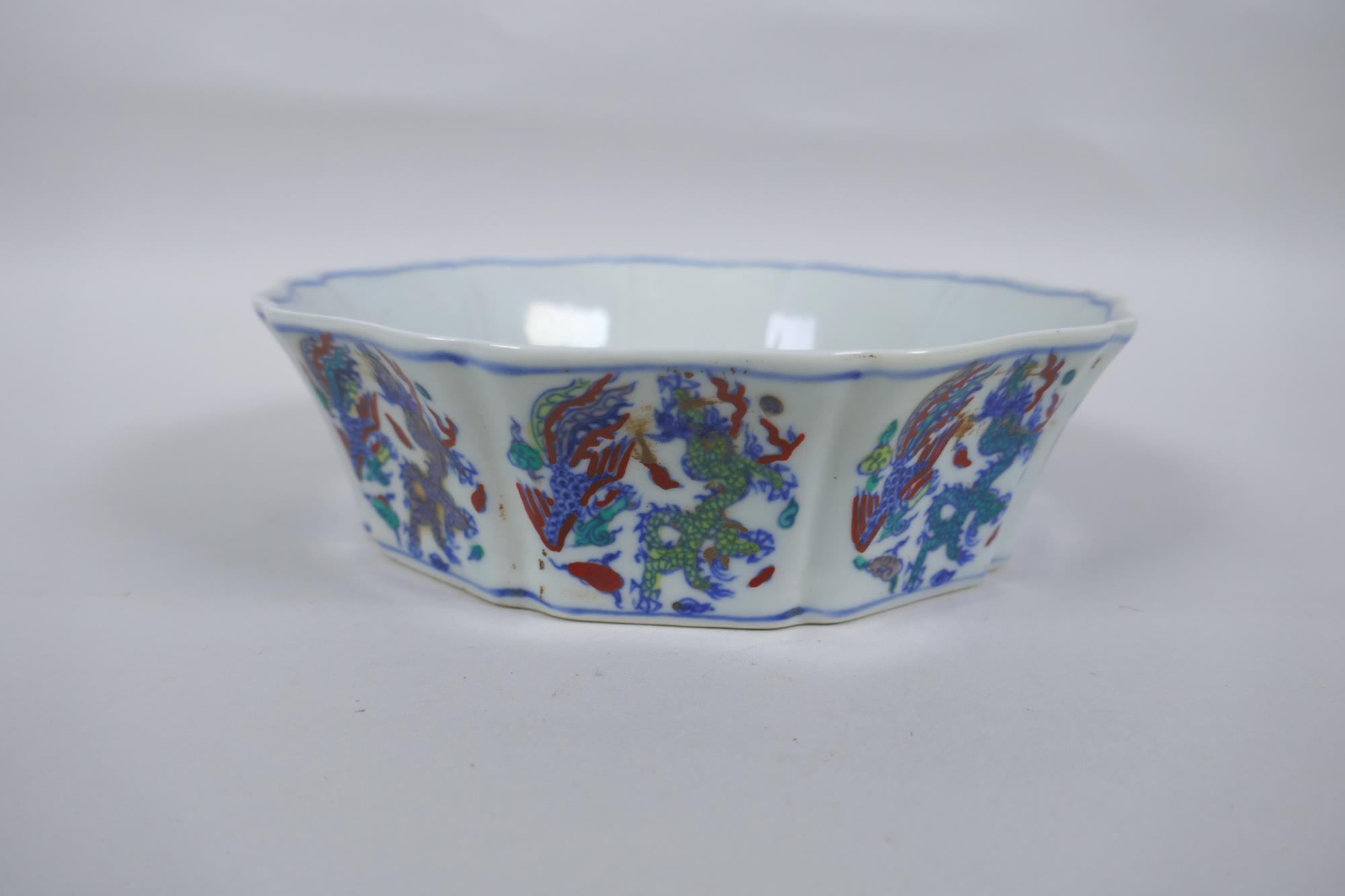 A Chinese Wucai porcelain steep sided bowl of lobed form, with allover dragon and phoenix - Image 2 of 4