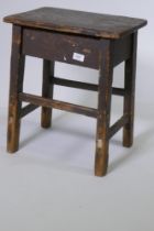 An antique oriental rustic stool, 42 x 30cm, 50cm high