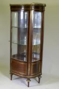 A C19th French mahogany vitrine, inlaid with brass and with ormolu mounts, the marble top with