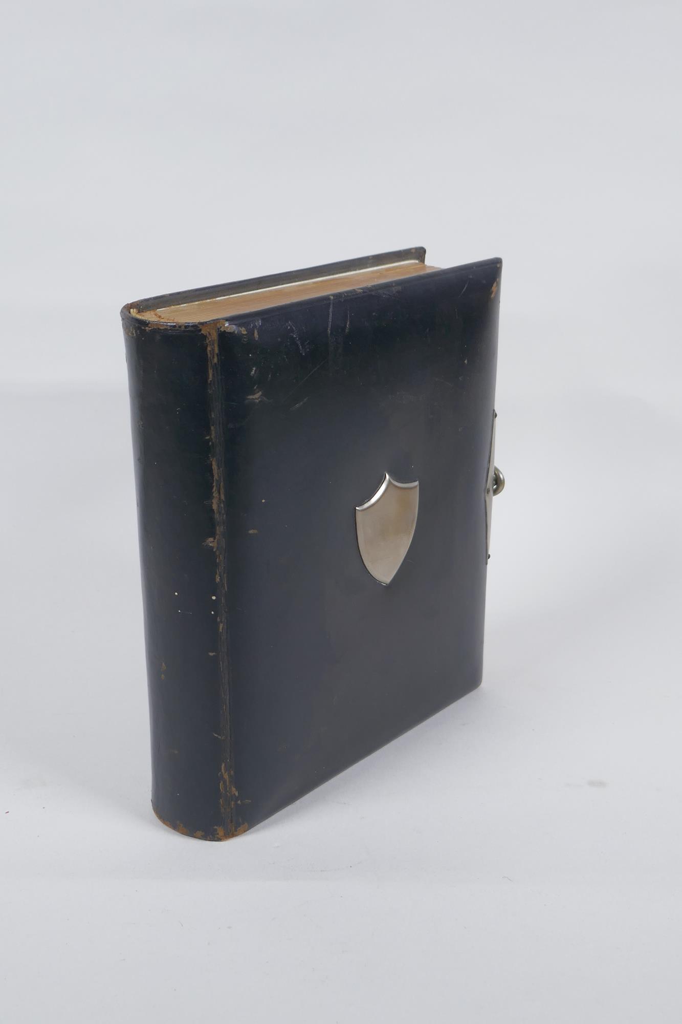 A Victorian tooled leather photograph album with silver plated mounts, 17 x 20cm
