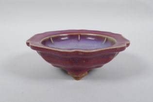 A Chinese Jun ware dish/censer on tripod supports with a petal shaped rim, character mark to base,