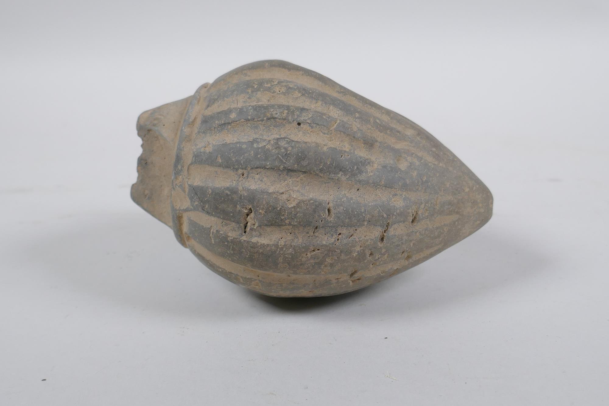 An early ceramic hand grenade/bomb, possibly C12th/C13th, with ribbed body and impressed motifs, - Image 3 of 5