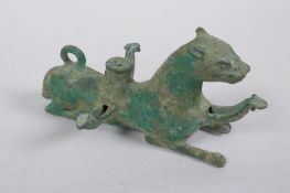 A Persian cast metal oil lamp in the form of a lion, 15cm long