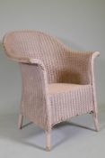 An antique Lloyd Loom wicker chair