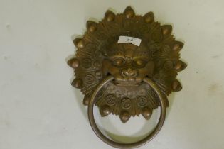 A Chinese lion mask bronze door knocker, 25cm long