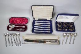 A quantity of silver flatware to include a set of six napkin rings by Ari D. Norman, (London