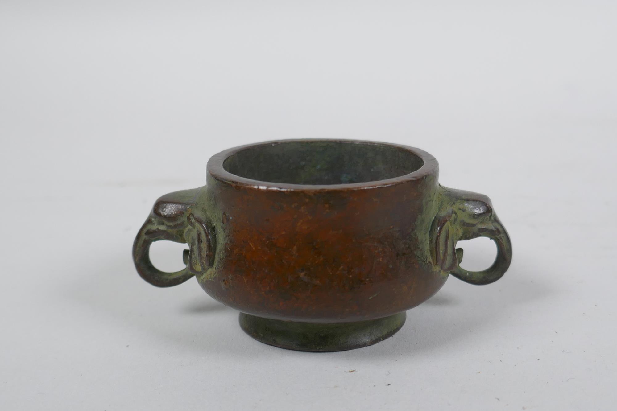 A miniature Chinese bronze censer with two elephant mask handles, and another with lion mask handles - Image 2 of 7