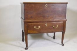 An C18th Georgian oak mule chest, with lift up top and single drawer, raised on cabriole supports