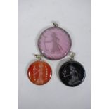 Three Persian white metal pendants set with engraved figural intaglio stones