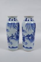 A pair of Chinese blue and white porcelain vases decorated with figures in a garden, 23cm high