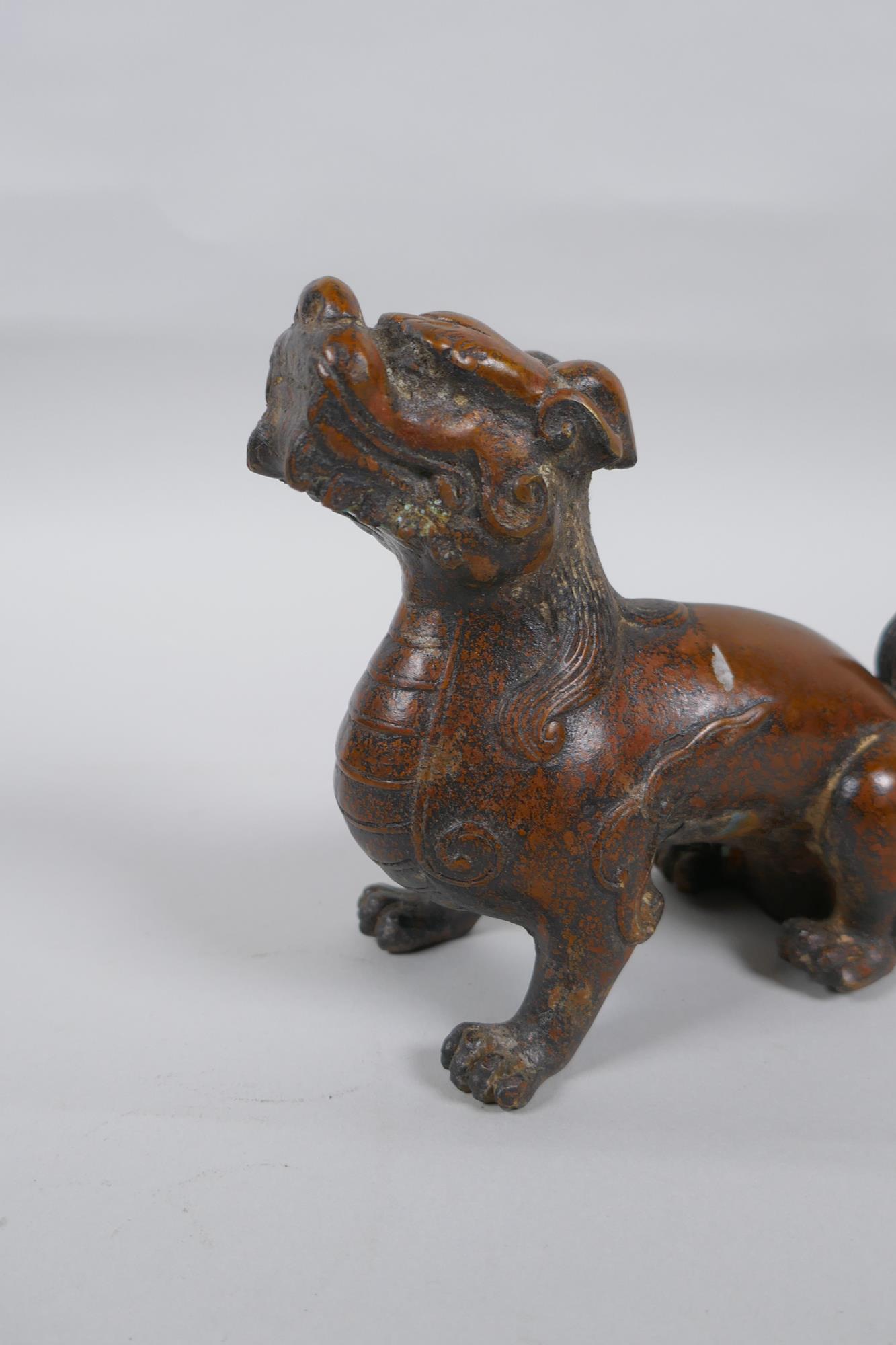 A Chinese filled coppered metal kylin, 16cm long - Image 3 of 3