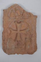 An antique terracotta panel with raised decoration of a coptic cross and figure, 10 x 16cm