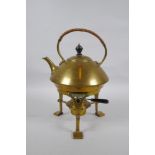 An Arts and Crafts brass spirit kettle, 29cm high