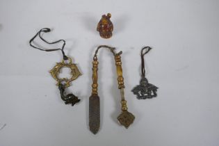 Two Tibetan brass medical instruments/tools, together with a Sino Tibetan bronze Buddha and two