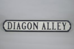 A painted wood Harry Potter 'Diagon Alley' road sign, 14 x 78cm long