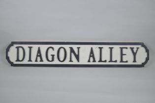 A painted wood Harry Potter 'Diagon Alley' road sign, 14 x 78cm long