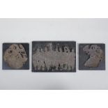 Three Mongolian white metal foil raised figural plaques, on ebonised wood panels, largest 20 x 14cm