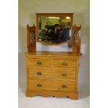 A Victorian satinwood dressing table, the upper section with mirror flanked by glazed cabinets,