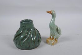 An oriental celadon flambe glazed pottery water pot, and a Chinese celadon glazed duck, 11cm high