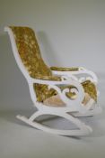 An antique painted rocking chair with Liberty style fabric cover