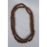 A string of Tibetan Rudraksha seed mala beads, 176cm long