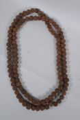 A string of Tibetan Rudraksha seed mala beads, 176cm long