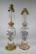 A pair of famille rose porcelain vases converted to lamps, with matching painted bases, 67cm highest