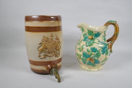 A Mason's Ironstone hand painted pitcher with oak decoration, 24cm high, and an antique stoneware