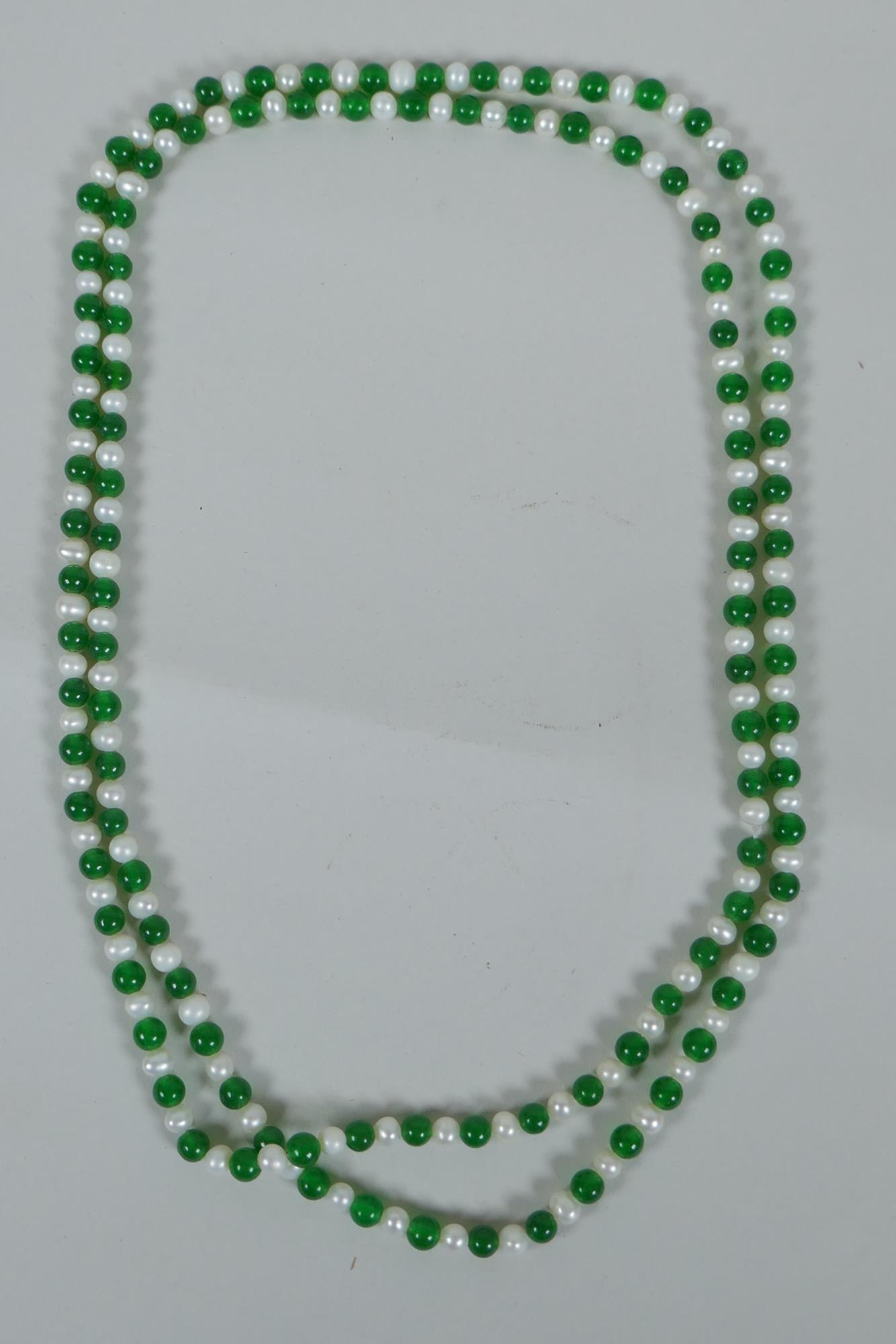 A green hardstone and faux pearl bead necklace, 120cm long