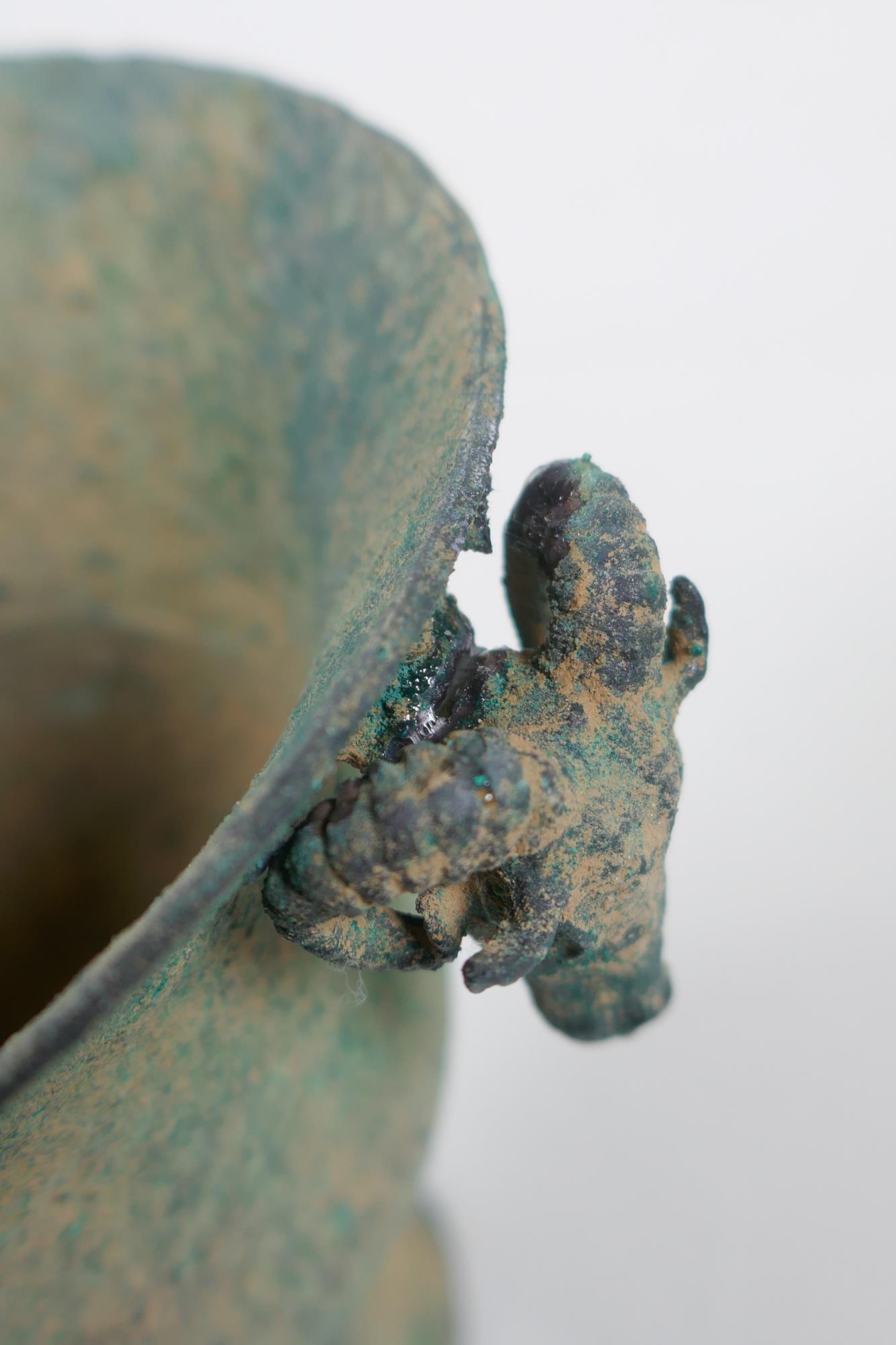 An antique metal goblet with rams head mounts, and green patina, 12cm high - Image 5 of 5